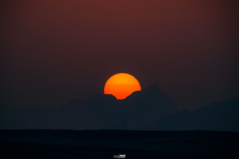 romantic sky, sun, 5K, beauty in nature, tranquil scene, sea, copy space, sunset, tranquility, orange color, silhouette, water, outdoors, screengrab, mountain top