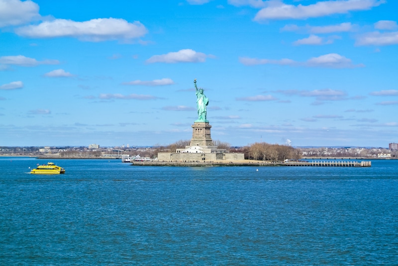 outdoors, cities, liberty, female likeness, manhattan, no people, the past, new-york, waterfront, history, new york, built structure, clouds, blue, travel