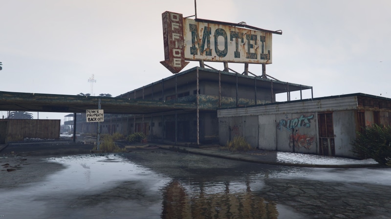 outdoors, capital letter, architecture, text, Grand Theft Auto V, signage, reflection, sign, day, western script, sky, deterioration, water, video games