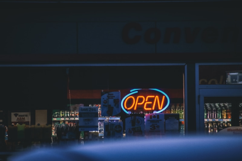 commercial sign, motion, built structure, capital letter, signage, turned, gasstation, 5K, outdoors, night, lcd screen, screen, metropolis, electronics
