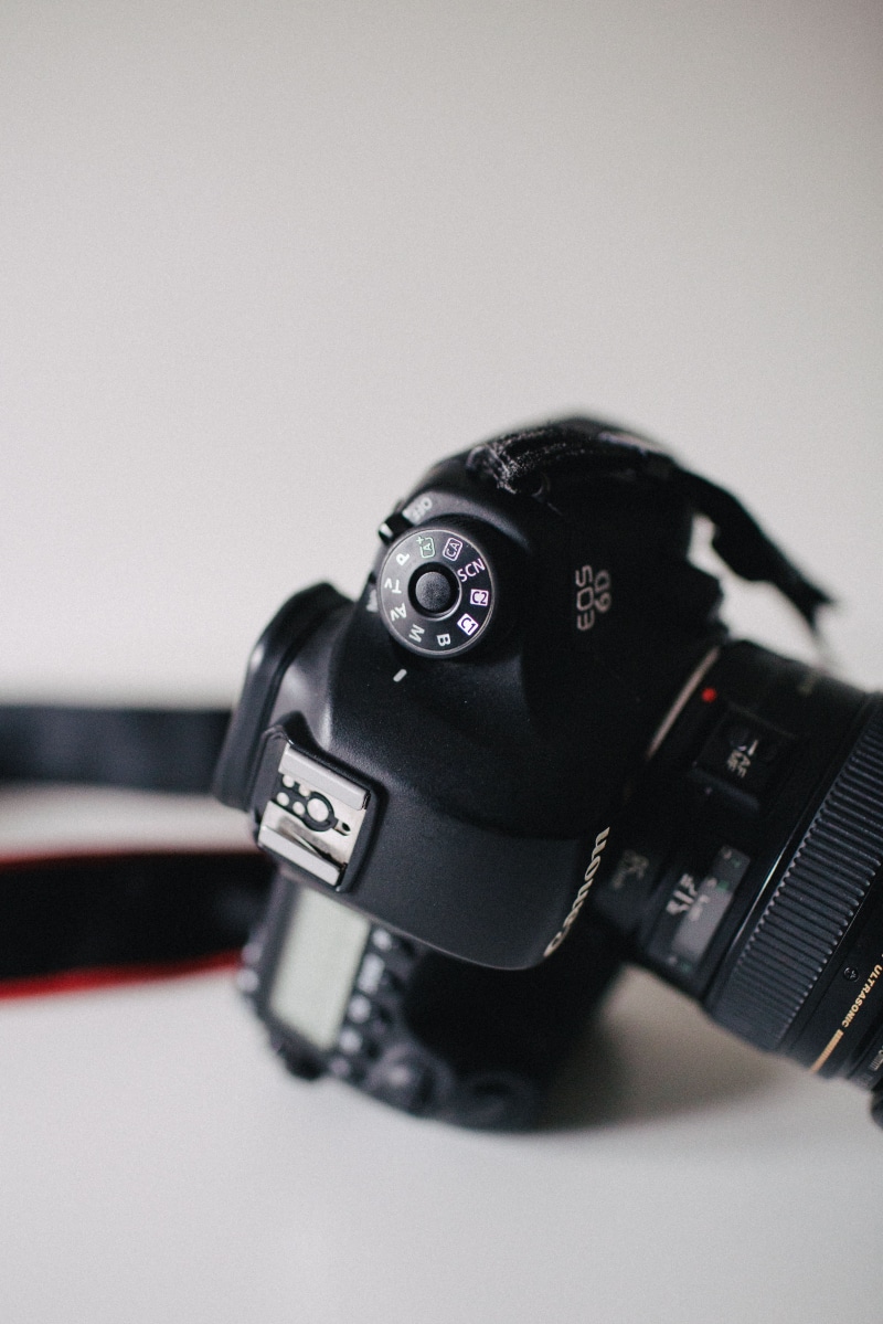 monitor, wireless technology, video camera, lens cap, black, display, technology, spoke, table, symbol, camera, surface, clothing, no people, indoors, machine