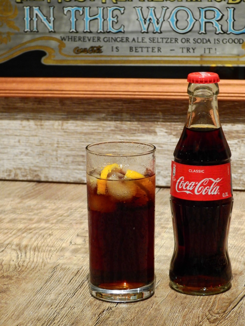 cola, coca cola, glass - material, highball, lemonade, food, shield, freshness, coke, food and drink, indoors, brand, glass, bottle, sugar, logo, advertisement