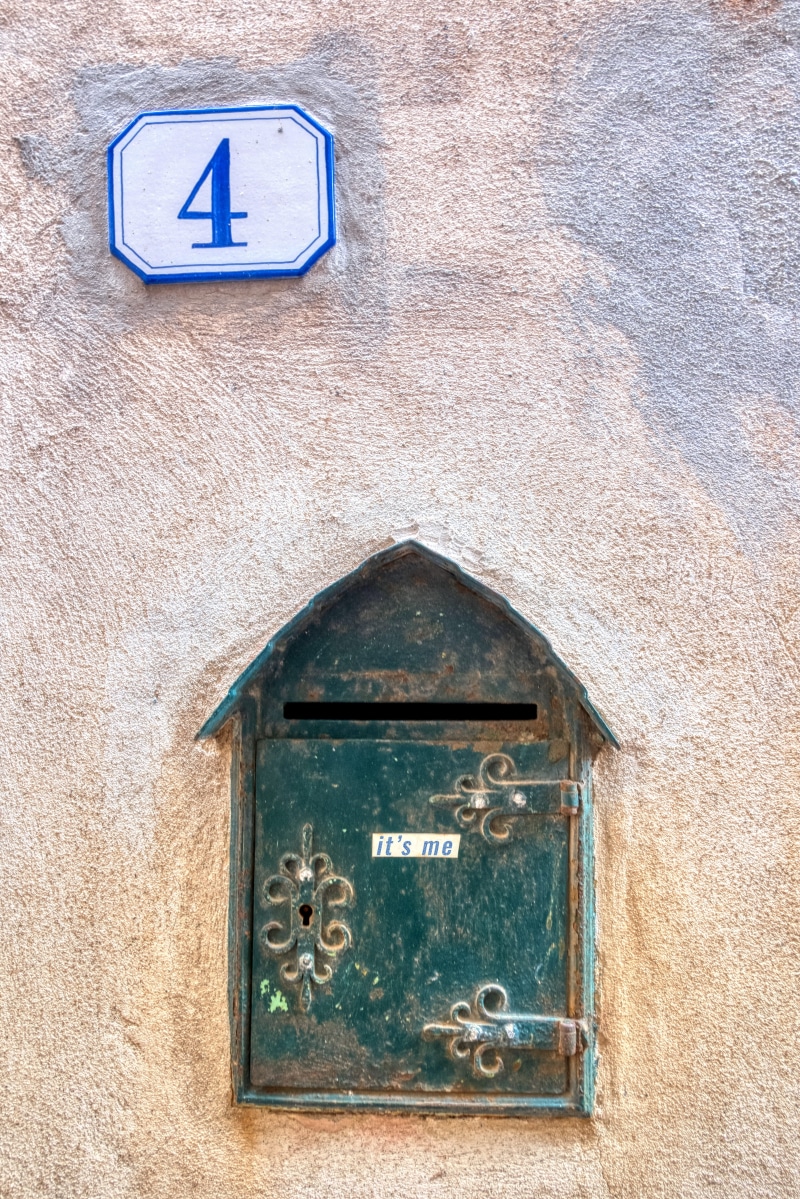 symbol, wall - building feature, sphere, mailbox, money, trademark, logo, letter, old, close-up, rubble, hole, postal office, flagstone, window, wood - material