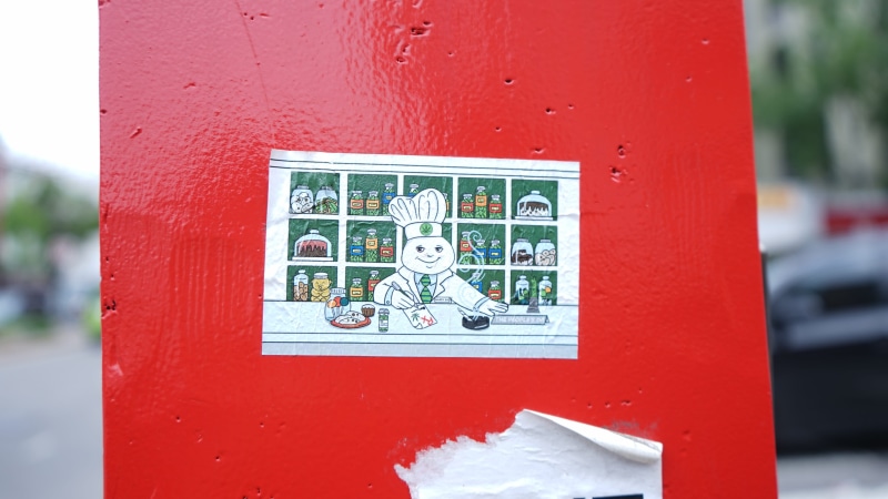 technology, wall - building feature, label, paper, drawing, sticker, city, new york, communication, street, built structure, focus on foreground, electricity