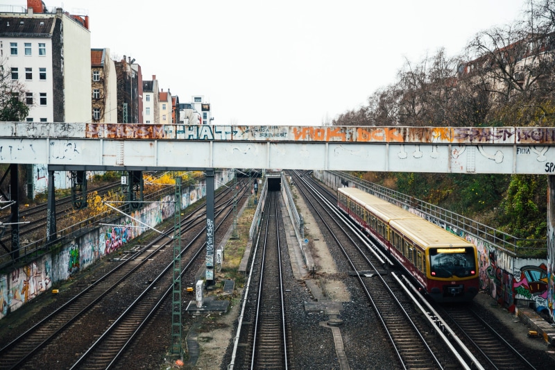 grafitti, building, wall, art, background, connection, building exterior, built structure, travel, urban, train - vehicle, train tracks, public, subway