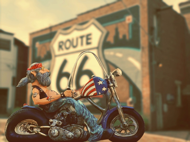 real people, route, building exterior, cruiser, architecture, asphalt, road trip, one person, city, road, motor scooter, lifestyles, helmet, motorcycle