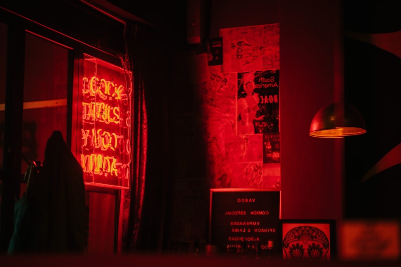 frame, building exterior, sign, indoors, city, illuminated, neon, pendant, 8K, communication, lamp, architecture, non-western script, text, business, neon sign