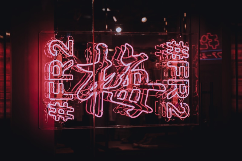 signage, night, close-up, nightlife, architecture, western script, red, window, creativity, indoors, illuminated, fr, neon, lighting equipment, black background