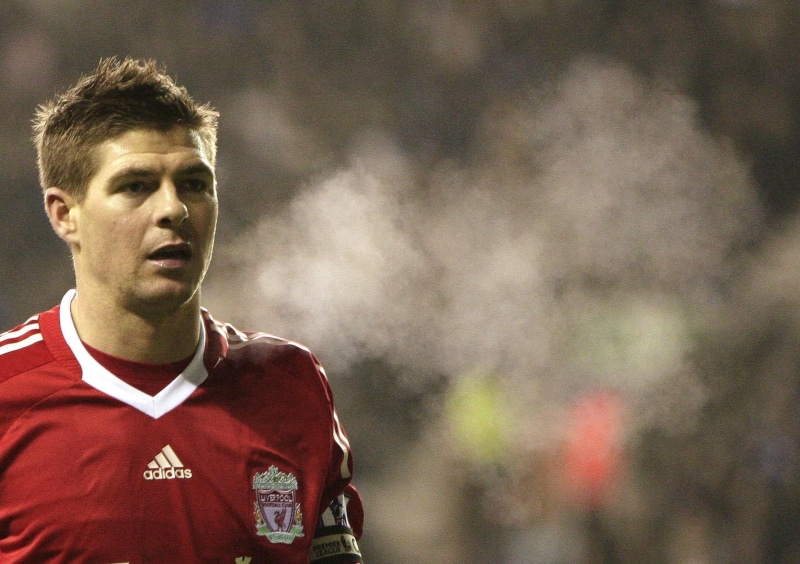 portrait, outdoors, looking at camera, Liverpool FC, one person, headshot, young adult, lifestyles, uniform, standing, real people, young men, smoke - physical structure