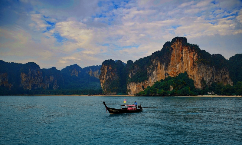 railay bay, mountain, ao nang, rock, travel, tropics, land, phuket, bay, beauty in nature, sky, thailand, solid, transportation, boat, scenics - nature