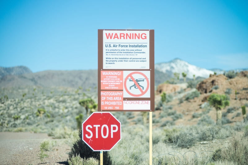 blue, nature, warning sign, warning symbol, focus on foreground, plant, nevada, safety, apparel, clear sky, day, information, no people, sky, nevada, hardhat
