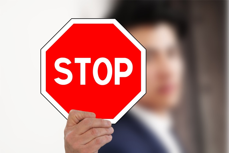 holding, human body part, message, field, text, road sign, communication, hand, presentation, white color, stop sign, stop - single word, one person, board