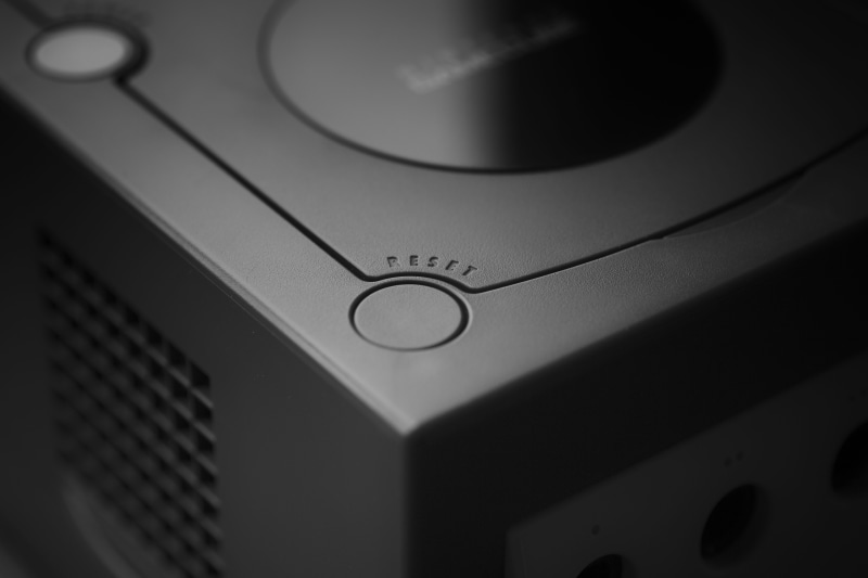 selective focus, reset, nintendo, high angle view, control, circle, close-up, music, studio shot, gaming, shape, no people, macro, indoors, science, text
