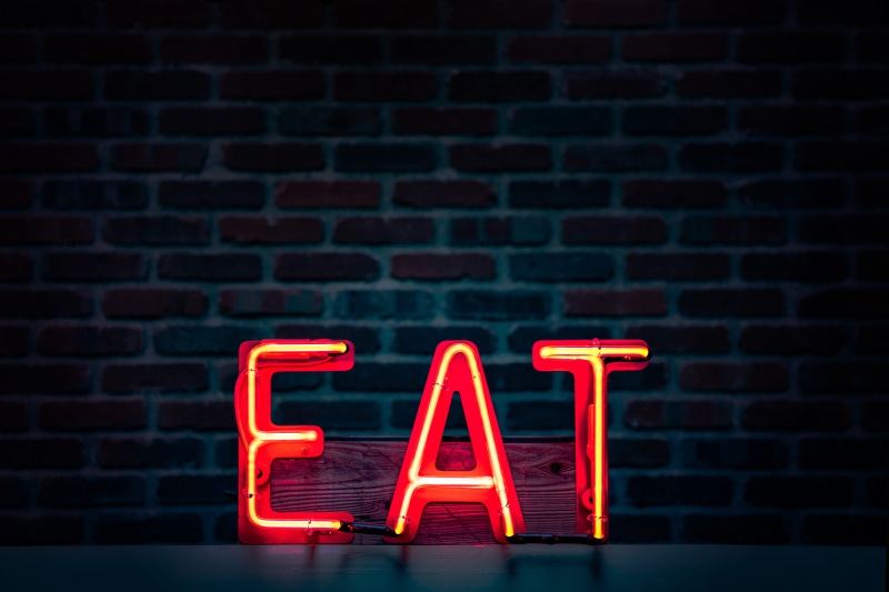brick wall, neon, indoors, communication, capital letter, turned, small business, word, text, red, no people, brick, 8K, night, glowing, architecture