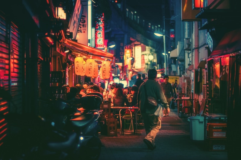 architecture, patio, building exterior, 1080P, outdoors, city, incidental people, built structure, illuminated, real people, design, city life, text, men