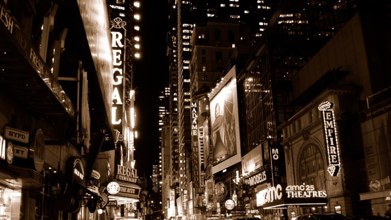 skyscraper, illuminated, street, night, road, the way forward, theaters, sign, built structure, travel destinations, transportation, low angle view, city life