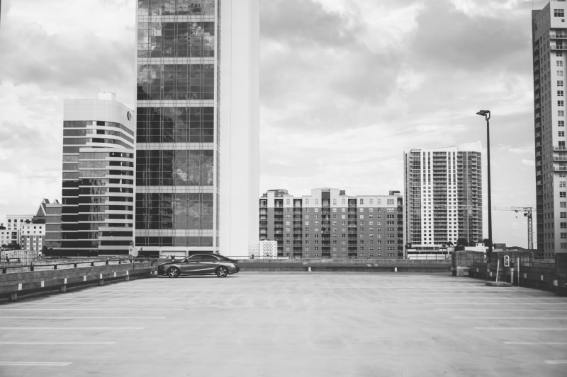 background, rise, cloud - sky, street, apartment building, photography, black and white, land vehicle, town, metropolis, building, housing, sky, building exterior