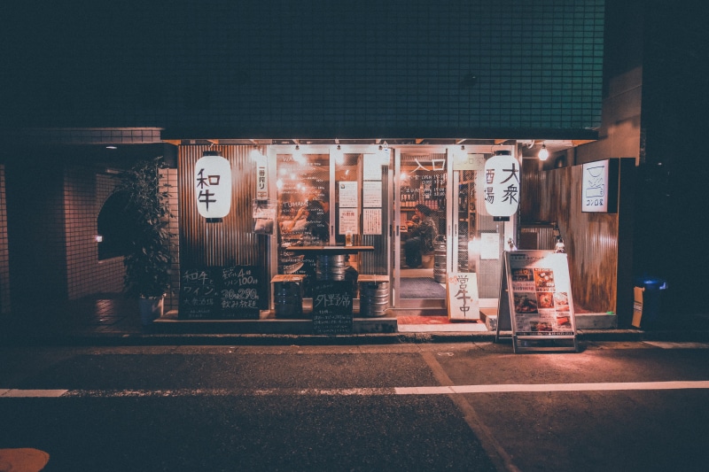 tarmac, street, religion, script, lantern, belief, shop, building exterior, urban, word, lighting equipment, road, illuminated, architecture, no people