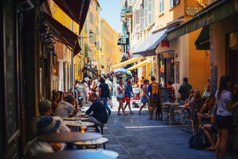 incidental people, city Life, group, real people, alleyway, building, city, crowd, group of people, dining, street, transportation, alley, travel, adult