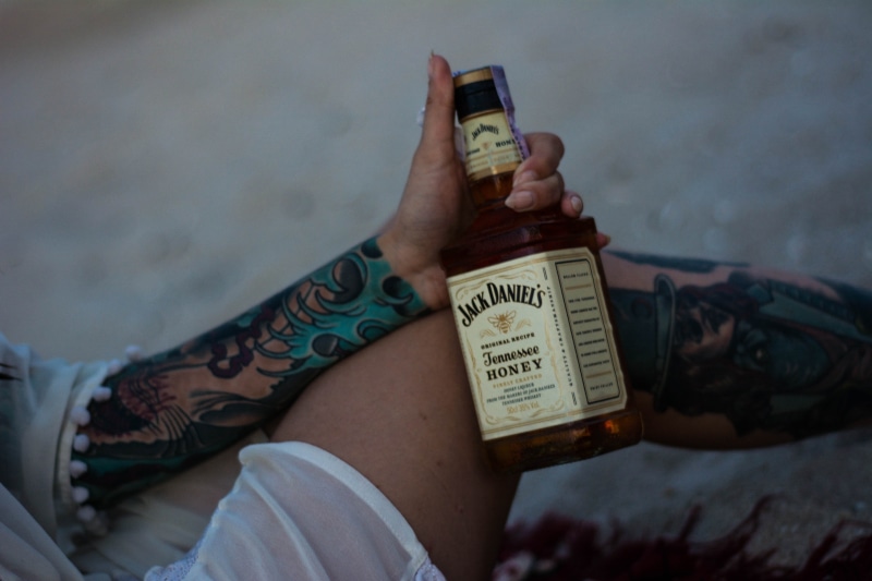 stepanivka persha, finance, jack daniels, lifestyles, bottle, human foot, tatoo, communication, low section, s, ukraine, beer, human limb, alcohol, drink