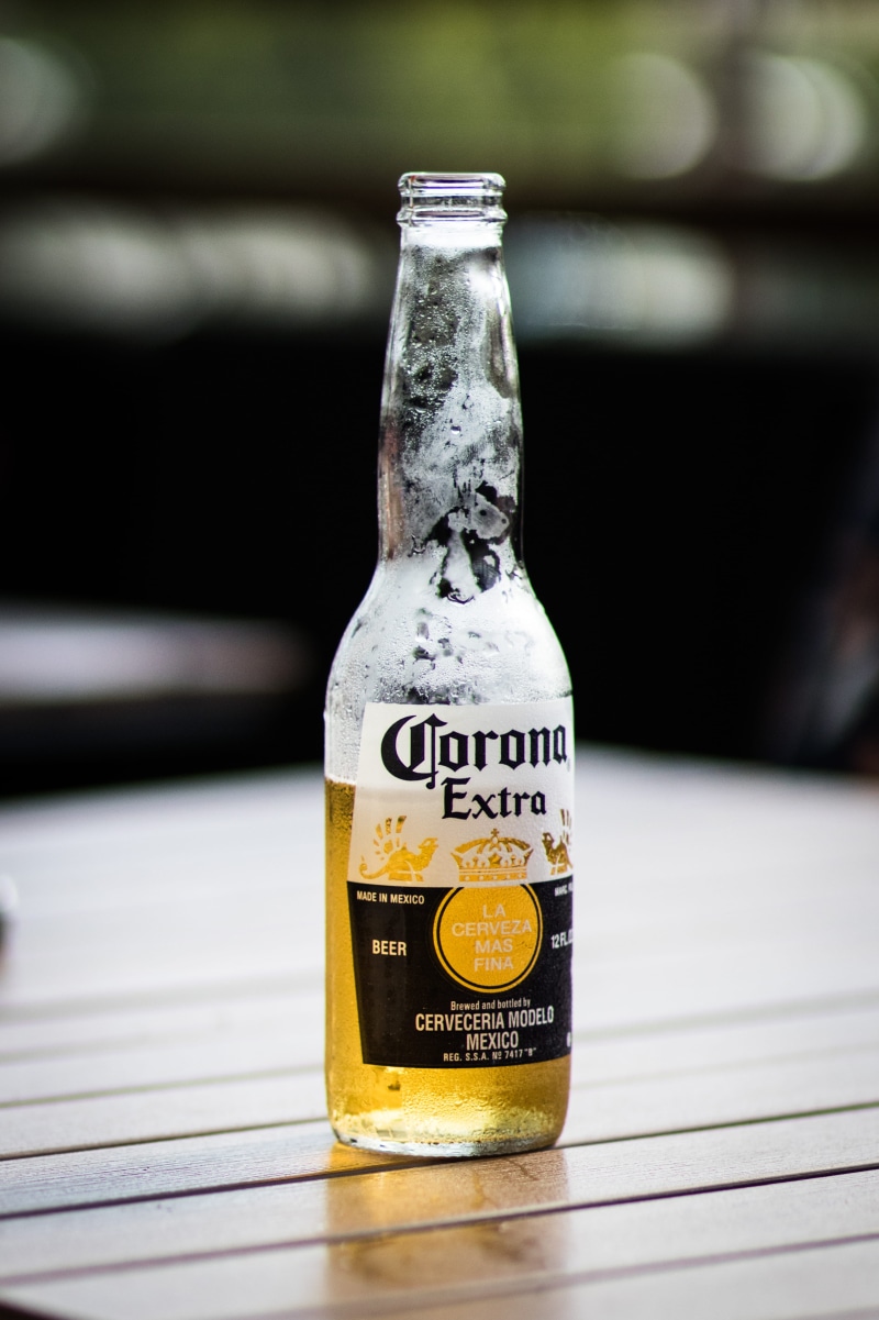 communication, wood - material, close-up, refreshment, food and drink, wooden, daytime, alcoholic, bottle, single object, refreshing, no people, text, container