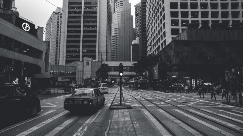 street photography, transportation, symmetry, urban, mono, hk, city, perspective, hour, city street, bw, outdoors, land vehicle, sign, building exterior