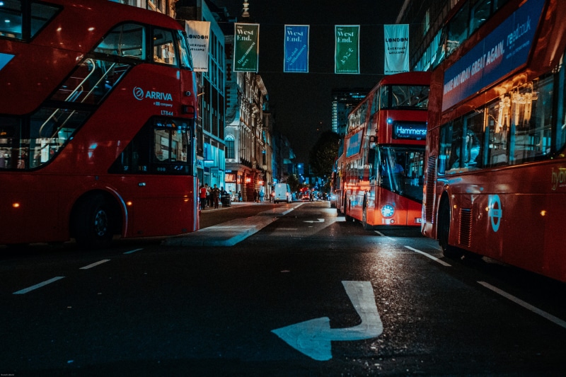 movie, mode of transportation, city, photography, built structure, black, double decker, night, deck, oxford street, direction, shopping, motor vehicle