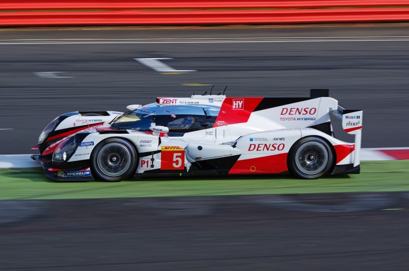 competitive sport, mode of transportation, transportation, denso, auto racing, racing, racecar, day, formula one racing, motorsport, wheel, red, motion