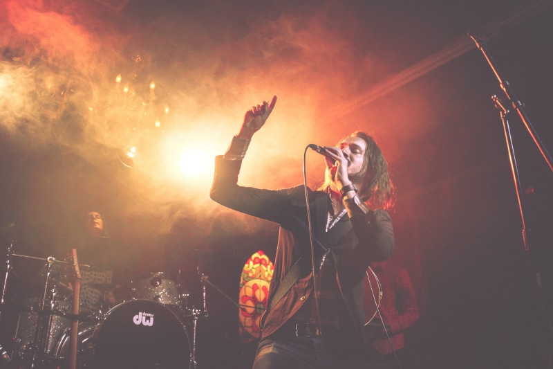 young Adult, microphone, stage, nightclub, arts culture and entertainment, party - Social Event, orange color, stage - Performance Space, stage Light, entertainment