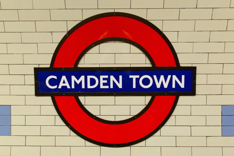 western script, communication, circle, sign, wall - building feature, geometric shape, wall, text, Camden Town, shot, brick wall, camden, no people, captured