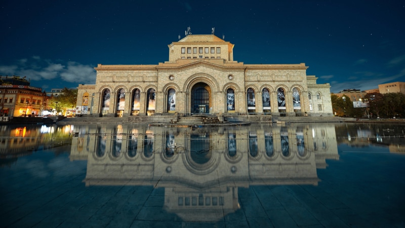illuminated, facade, ornate, arch, travel destinations, outdoors, house, built structure, night, the past, reflection, beige, concrete, tourism, architecture