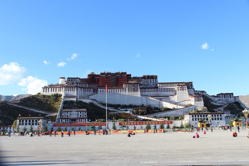 Potala Palace, sand, tourist, real people, building exterior, 2K, nature, tourism, beach, city, outdoors, incidental people, day, travel destinations