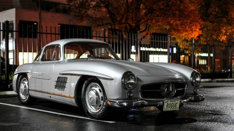 stationary, mercedes benz 300sl, outdoors, architecture, city, car, building exterior, no people, headlight, luxury car, retro styled, tree, street, white car