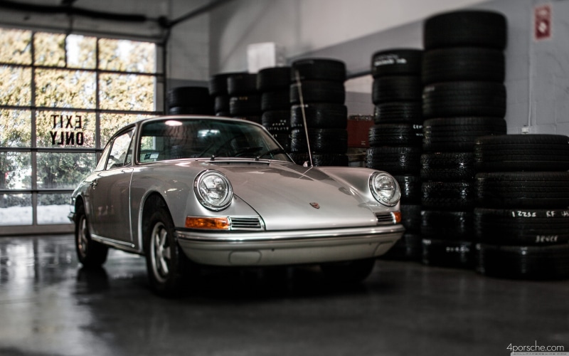 Porsche, vintage, car, glass - material, day, wealth, large group of objects, no people, coupe, built structure, motor vehicle, vehicle, indoors, Porsche 911