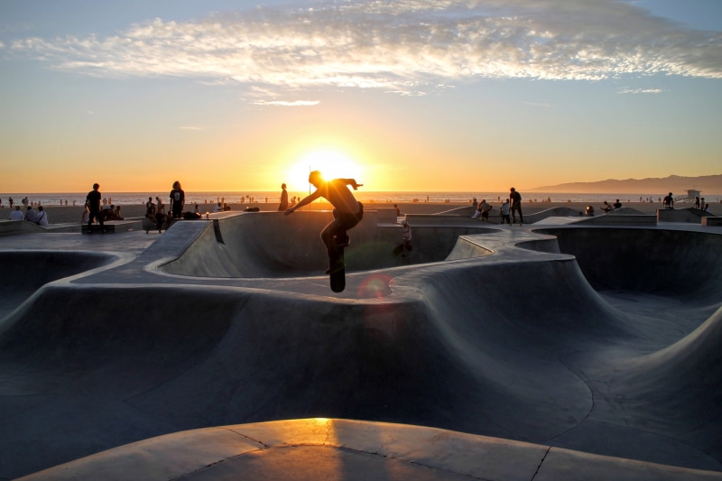 jump, real people, man, sunlight, skater, skateboarding, silhouette, men, skatepark, orange color, sky, water, skateboard, leisure activity