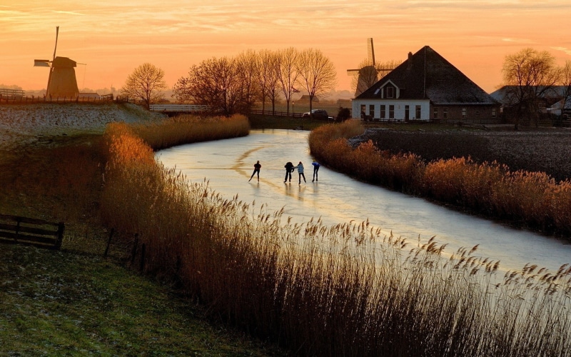 two people, men, sunset, building exterior, reflection, lake, outdoors, sky, landscape, lifestyles, water, real people, architecture, grass, people, 1080P