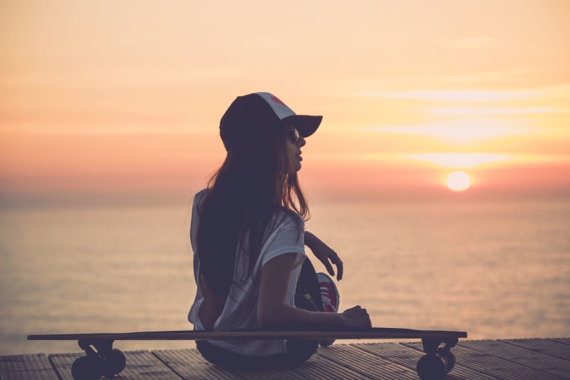 sky, leisure activity, 2K, adult, skateboarding, women, one person, skateboard, sunlight, outdoors, beauty in nature, water, hat, scenics - nature, real people
