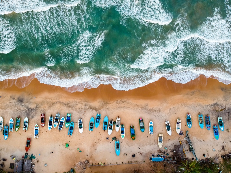 seashore, drone shot, tourism, vacation, beauty in nature, turquoise, aerial shot, scenic, outdoors, sport, arigam bay, high angle view, sea, waves, aquatic sport