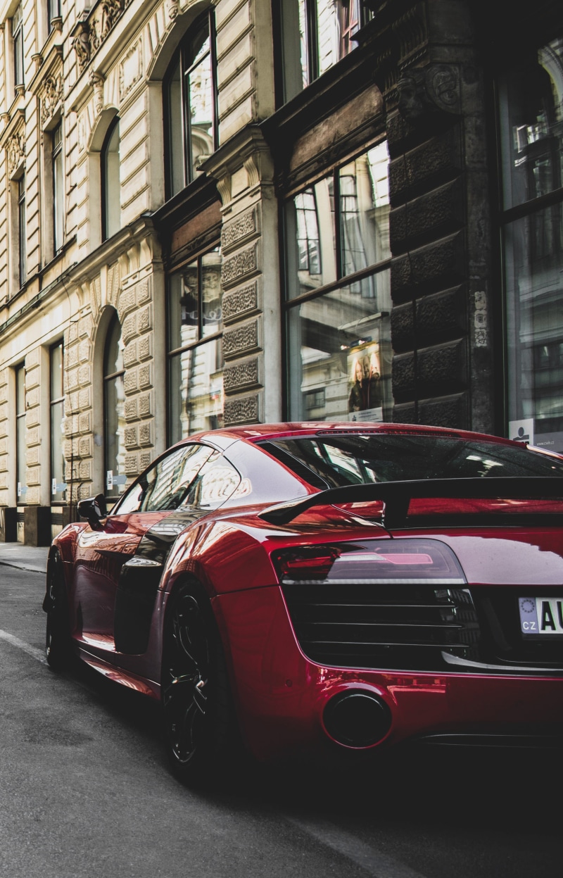 gray, street, mode of transportation, coupe, red, motor vehicle, road, stationary, building exterior, daylight, architecture, on the move, day, r, city