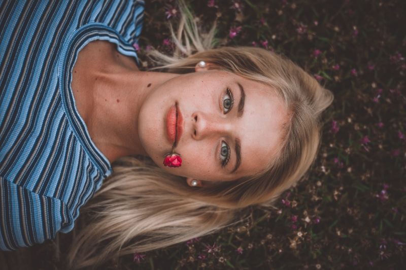 rose, beautiful eyes, striped, one person, lying down, photoshoot, fashion, person, model, real people, beauty, hair, headshot, young adult, lady, red flower