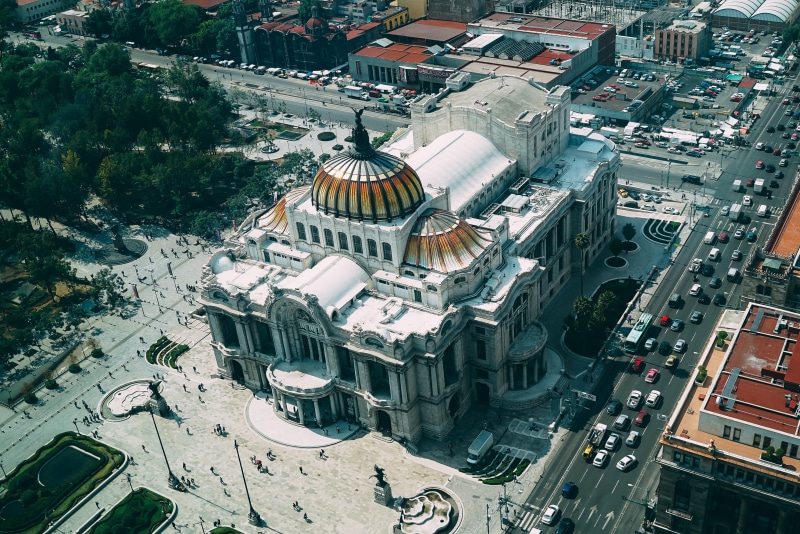 drone shot, transportation system, cars, landmark, city life, religion, s, high angle view, downtown, daylight, buildings, bird, building exterior, cityscape