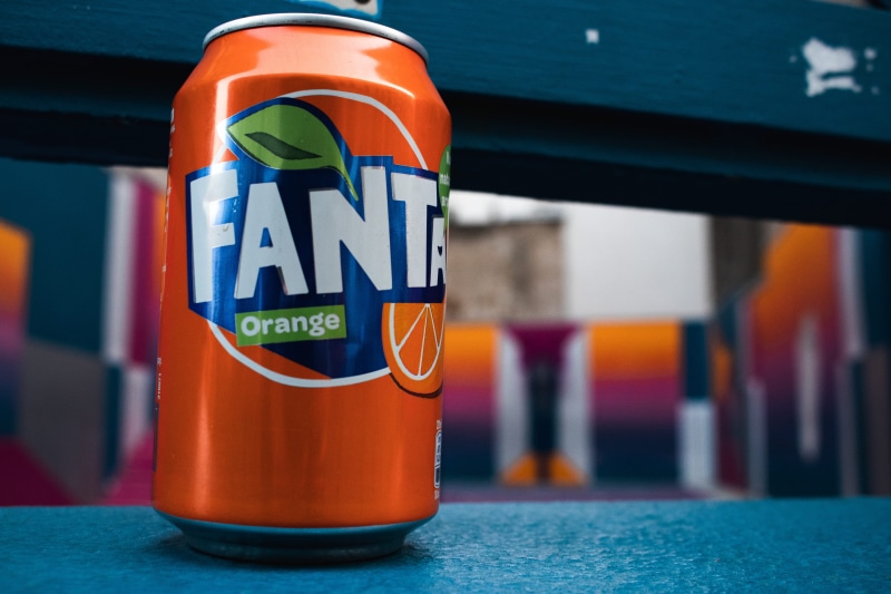city, macro photography, metal, Soft drink, depth of field, day, sign, multi colored, 5K, blur, garbage bin, indoors, no people, can, carbonated drink
