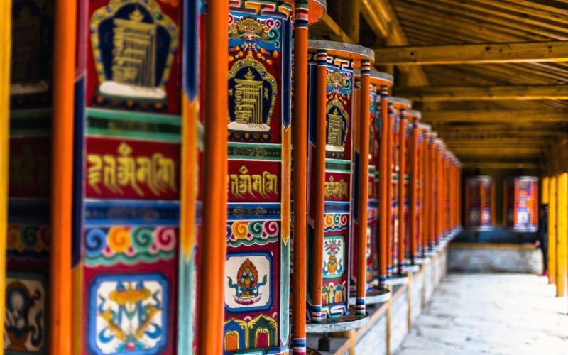 tibet, tibetan, temple, communication, large group of objects, architecture, focus on foreground, buddhist, belief, text, landscape, shelf, spirituality