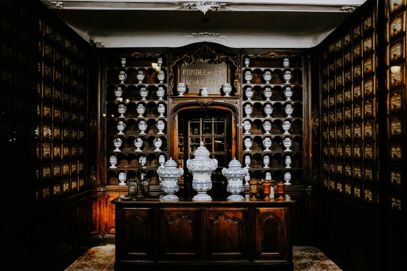 library, building, interior design, drink, altar, art and craft, representation, container, indoors, food and drink, book, church, no people, religion