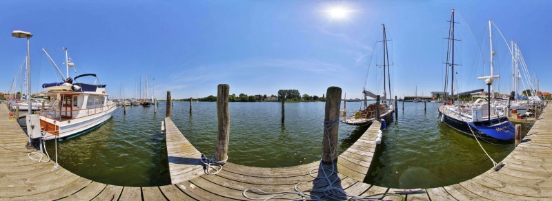 boat, gondola - traditional boat, travel destinations, no people, harbor, moored, sunlight, lagoon, sea, canal, reflection, sky, sailboat, pier, nautical vessel