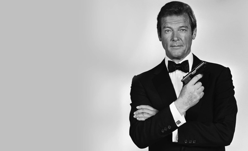 standing, adult, Roger Moore, suit, James Bond, waist up, looking at camera, tuxedo, one person, 1080P, men, front view, menswear, business, monochrome