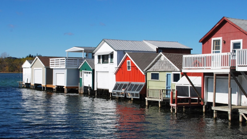 built structure, building, in a row, row house, boat houses, house, stilt house, Canandaigua, multi colored, blue, water, residential district, architecture