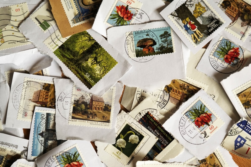 post, stamp, postage stamps, large group of objects, male likeness, still life, penpal, full frame, directly above, no people, lot, message, art and craft