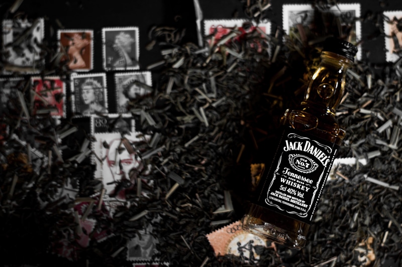 5K, s, indoors, postage, focus on foreground, decoration, close-up, text, jack, hanging, jack daniels, technology, tools, celebration, communication, bottle