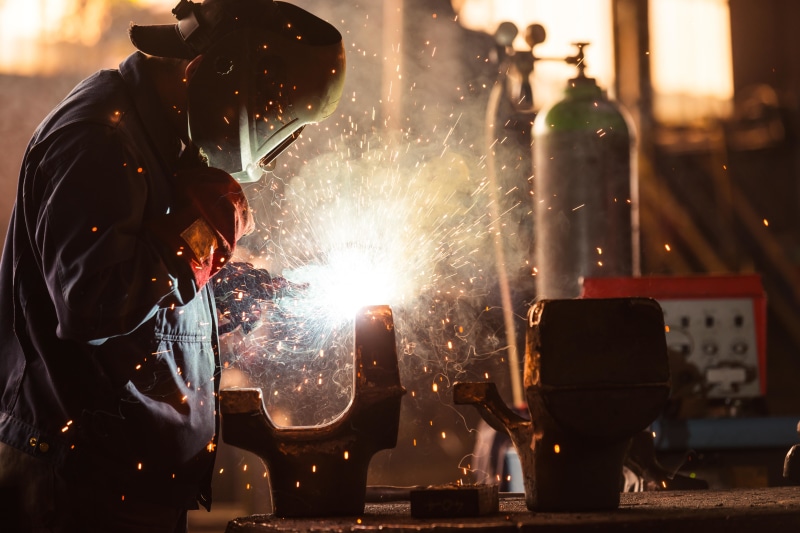 protection, glowing, real people, steel, heat - temperature, brown, illuminated, workers, occupation, metal, sparks, preparation, working, protective workwear